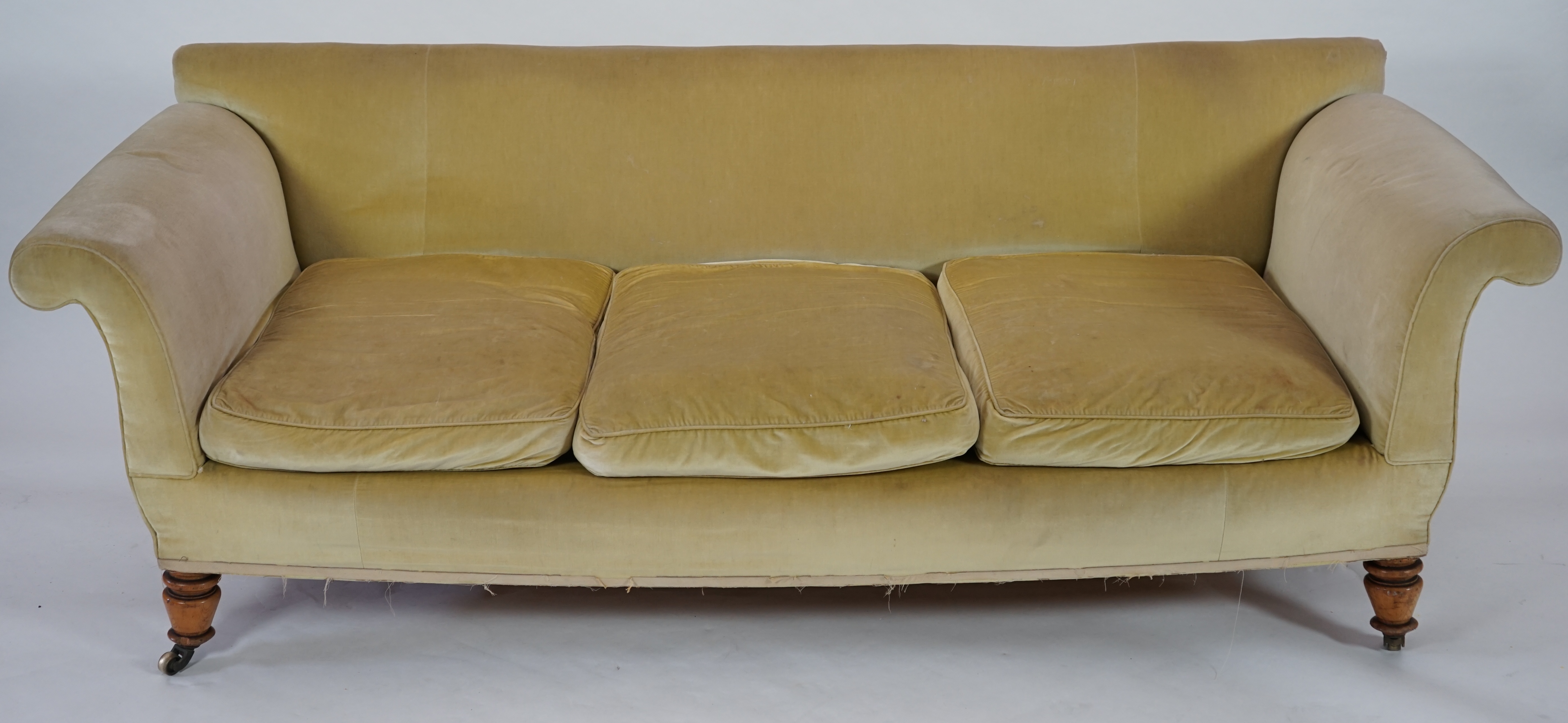 A large Victorian sofa, in the manner of Howard & Sons, probably Swietenia mahagoni with a Fagus sylvatica frame